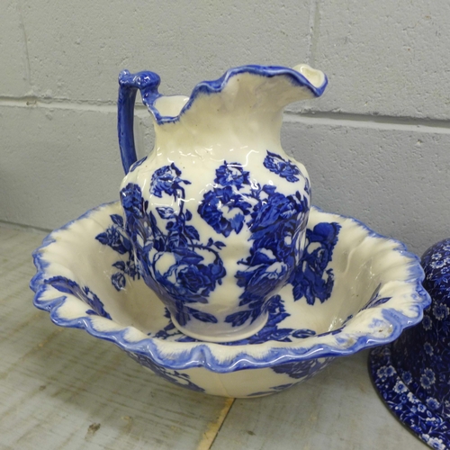 1084 - A Burleigh Calico blue and white rolling pin, a cheese dome and stand, tea pot, wash jug and bowl, e... 