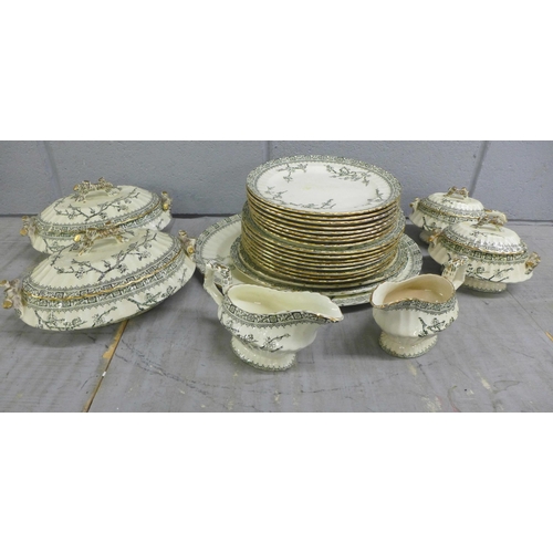 1100 - A Robert Heron & Son (Glasgow) green Thorn dinner service; eight plates, eight smaller plates, a tur... 