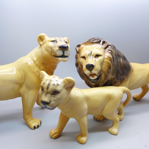 605 - A set of three Beswick lions