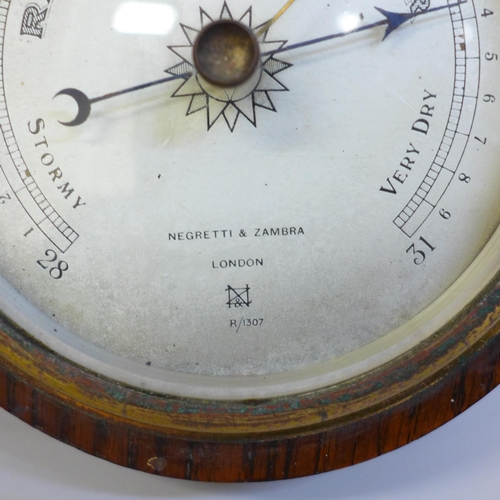 631 - A Victorian oak cased barometer marked Negretti & Zambra, London