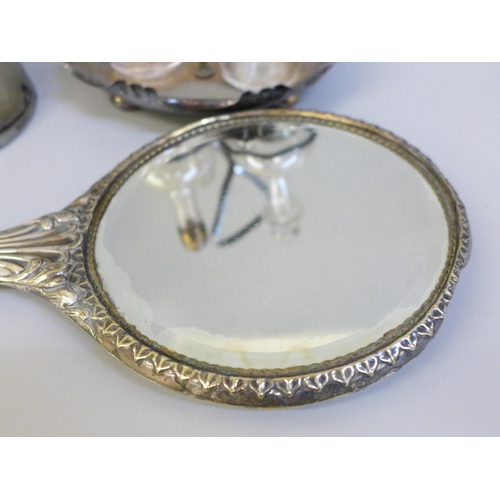 632 - An EPNS Reynolds Angels hand mirror, a metal mounted horse's hoof and a silver plated cruet set on s... 