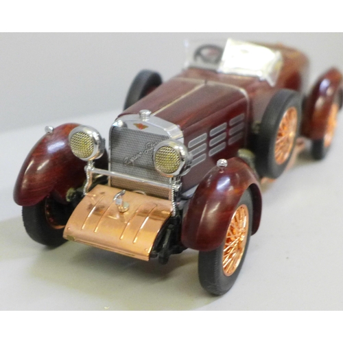 649 - A Franklin Mint 1924 Hispano-Swiza tulipwood vintage model vehicle with certificate in polystyrene b... 