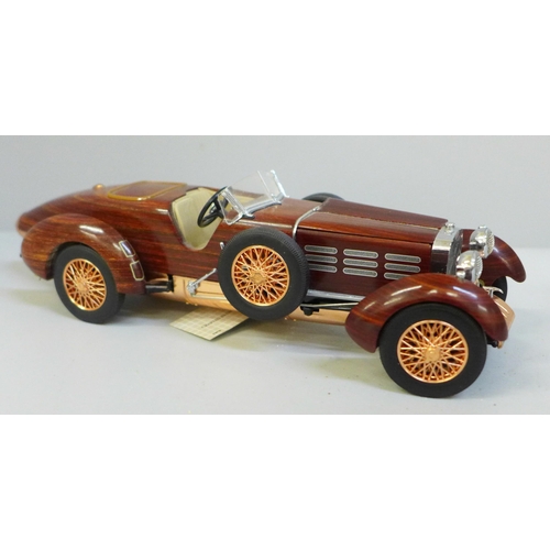 649 - A Franklin Mint 1924 Hispano-Swiza tulipwood vintage model vehicle with certificate in polystyrene b... 