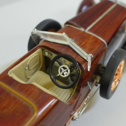 649 - A Franklin Mint 1924 Hispano-Swiza tulipwood vintage model vehicle with certificate in polystyrene b... 