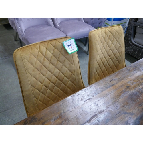 1337 - A Haryana dining table, bench and two turmeric chairs *This lot is subject to VAT