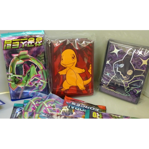 664 - Open packs of Pokemon cards, Japanese and English and Pokemon stickers