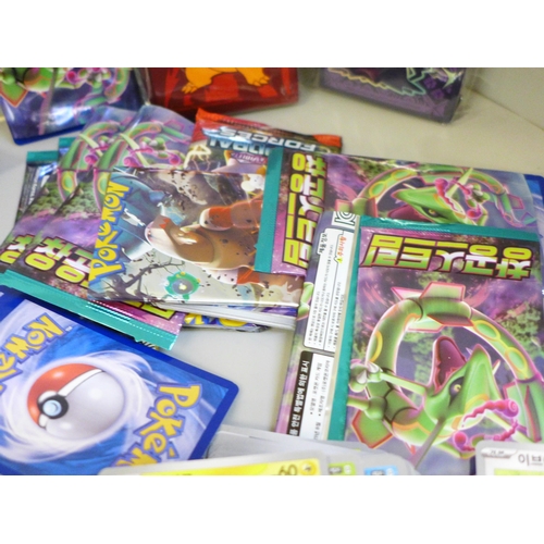 664 - Open packs of Pokemon cards, Japanese and English and Pokemon stickers