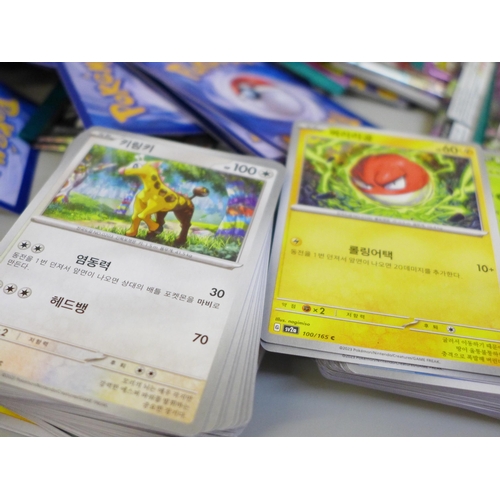 664 - Open packs of Pokemon cards, Japanese and English and Pokemon stickers