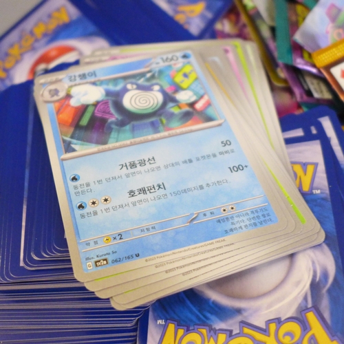 664 - Open packs of Pokemon cards, Japanese and English and Pokemon stickers