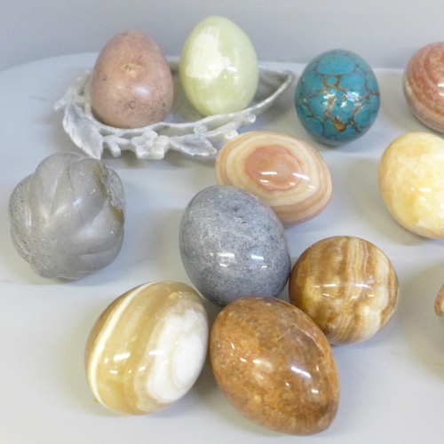 668 - A collection of gemstone eggs, marble, agate, onyx and a Chinese carved soapstone dish, etc.