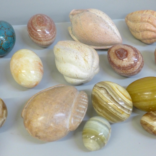 668 - A collection of gemstone eggs, marble, agate, onyx and a Chinese carved soapstone dish, etc.