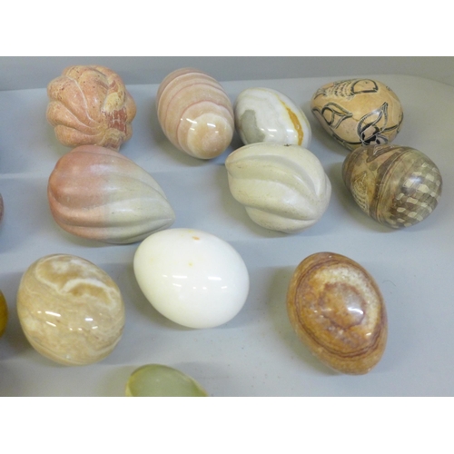 668 - A collection of gemstone eggs, marble, agate, onyx and a Chinese carved soapstone dish, etc.