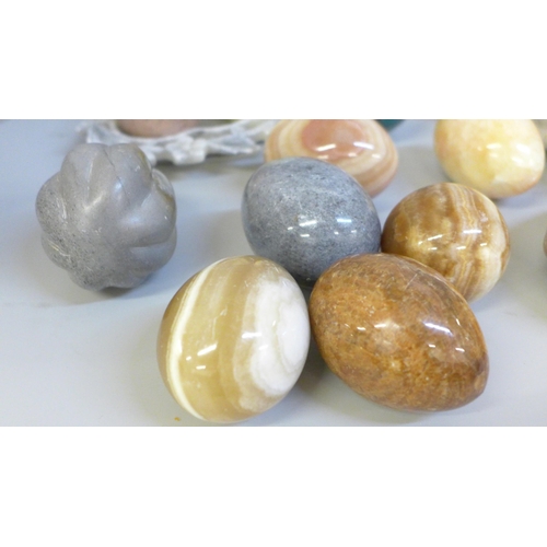 668 - A collection of gemstone eggs, marble, agate, onyx and a Chinese carved soapstone dish, etc.