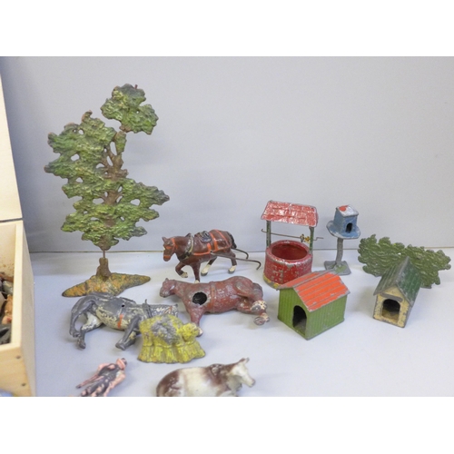 674 - A collection of lead farmyard animals and accessories, playworn, some a/f