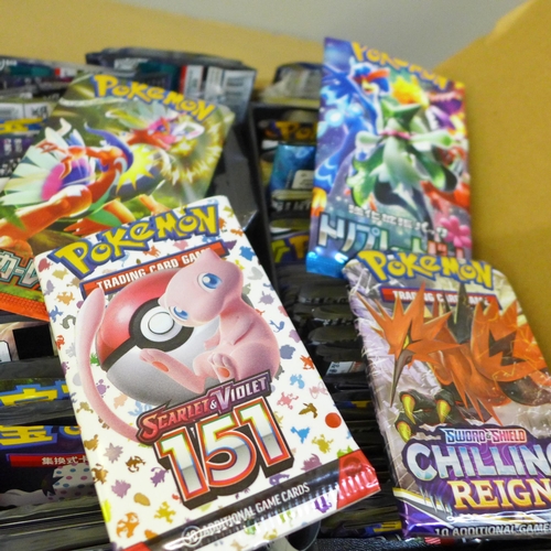 683 - A box of English and Japanese Pokemon Evolutions packs, opened plus Chinese and Korean