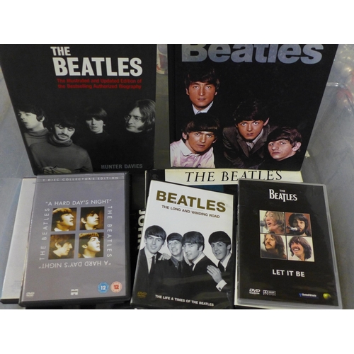 689 - A box of The Beatles and solo books and DVDs, clock, etc.