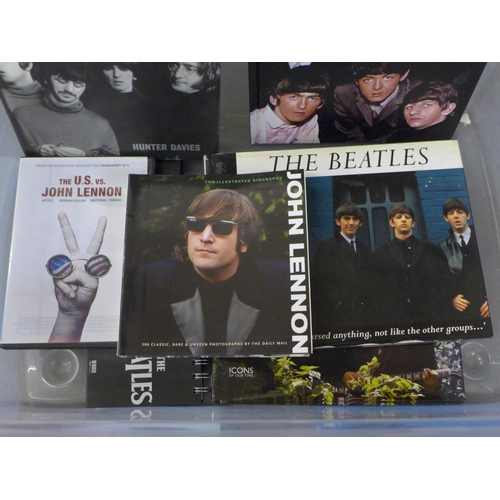 689 - A box of The Beatles and solo books and DVDs, clock, etc.