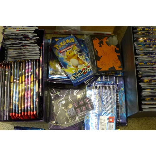 694 - A box of English and Japanese Pokemon Evolutions packs, opened