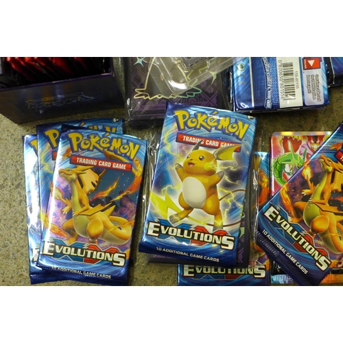 694 - A box of English and Japanese Pokemon Evolutions packs, opened