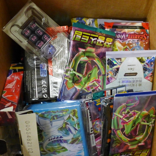 694 - A box of English and Japanese Pokemon Evolutions packs, opened