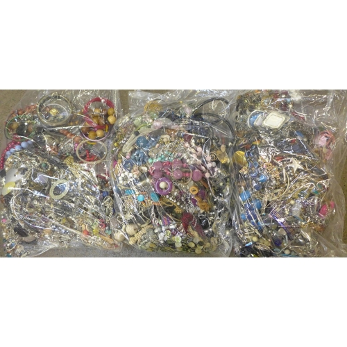 713 - Three large bags of costume jewellery