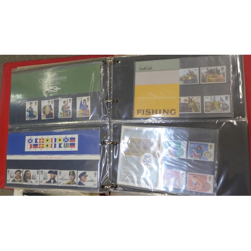 715 - A collection of stamps; British presentation packs, assorted covers, two Stamp of the World album bo... 