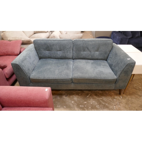 1412 - A dark teal velvet three seater sofa