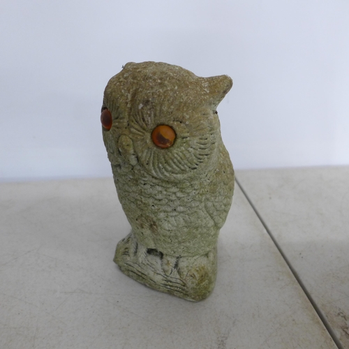 2227 - Three concrete animal figure garden ornaments including a rabbit, dog and owl. A concrete watering c... 