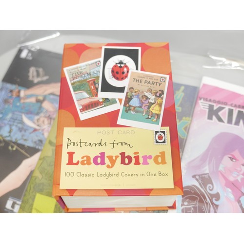 688B - A collection of modern comics and a box of Ladybird book postcards