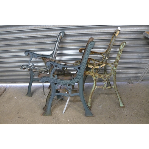 2210 - Five sets of assorted cast iron bench ends and a cast iron bench back