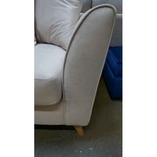 1429 - A light mink velvet two seater sofa