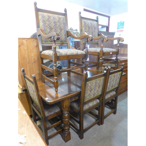 251 - A 17th Century style carved oak refectory table and six chairs