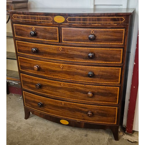 114 - A George III inlaid mahogany bow front chest of drawers