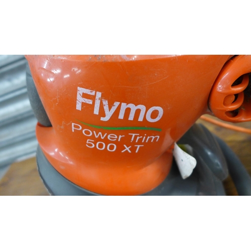 2237 - A Flymo Powertrim 500XT and a hose pipe on reel