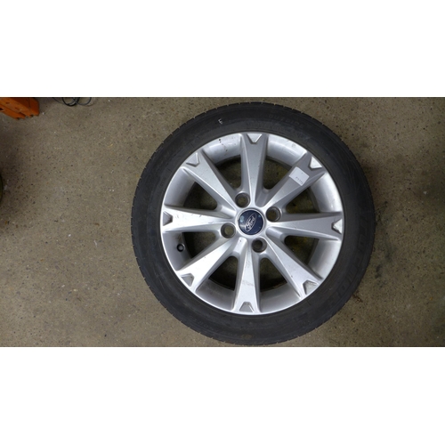 2238 - A set of four 16” alloy wheels to fit a Ford Fiesta with four used tyres