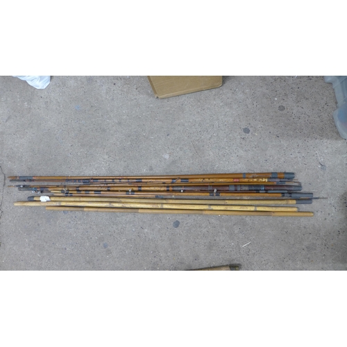 2245 - A quantity of assorted vintage fishing rods and poles