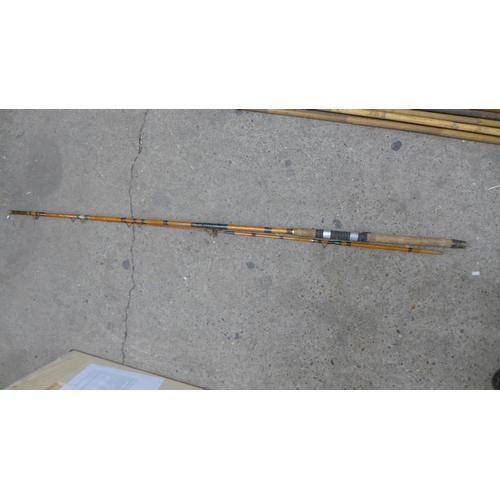 2245 - A quantity of assorted vintage fishing rods and poles