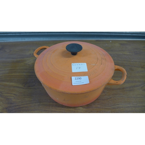 2290 - A volcanic orange Le Creuset cast iron casserole dish