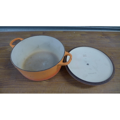 2290 - A volcanic orange Le Creuset cast iron casserole dish