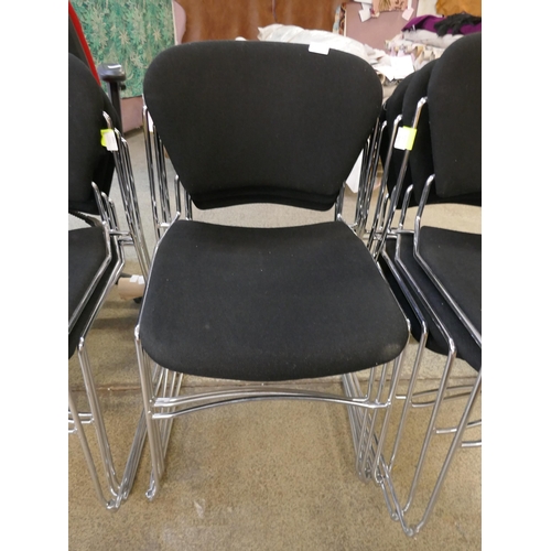 1528 - A set of seven chrome and black stacking chairs