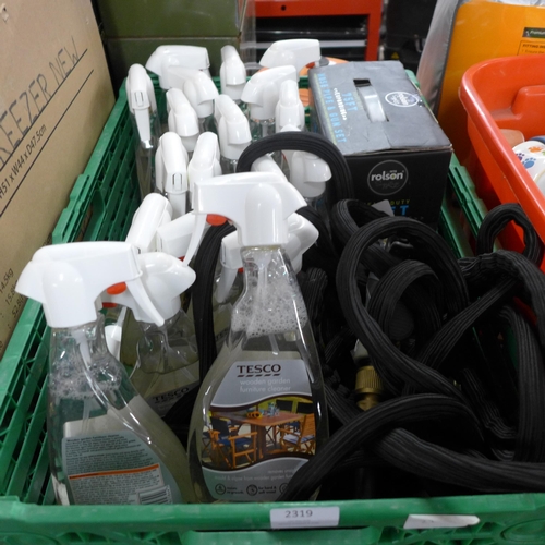 2319 - Approx. 30 bottles of Tesco wooden furniture cleaner and two hose pipes