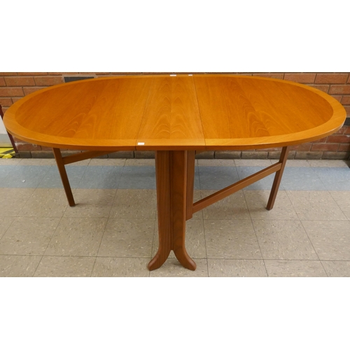 23 - A Nathan teak drop leaf table