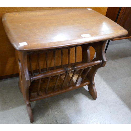 63 - An Ercol Golden Dawn ash table/magazine rack