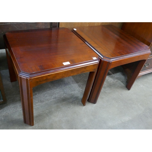 93 - A pair of mahogany octagonal lamp tables