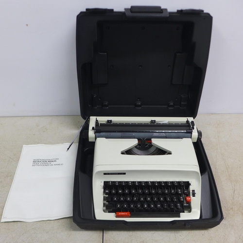 2069 - A Hermes 305 typewriter in hard carry case