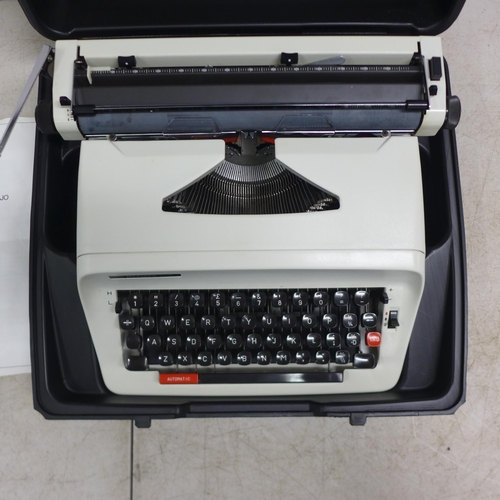 2069 - A Hermes 305 typewriter in hard carry case