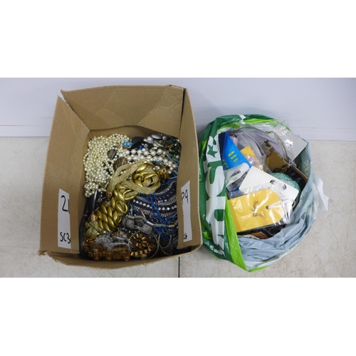 2092 - A box of costume jewelry and a bag of unusual costume jewelry