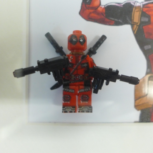 2105 - Four Lego Super Hero framed figures including Deadpool, Captain America, Iron Man and Thor