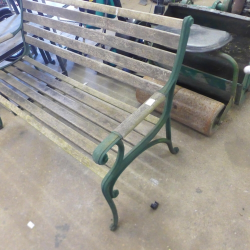 2186 - A wooden garden bench with cast iron bench ends