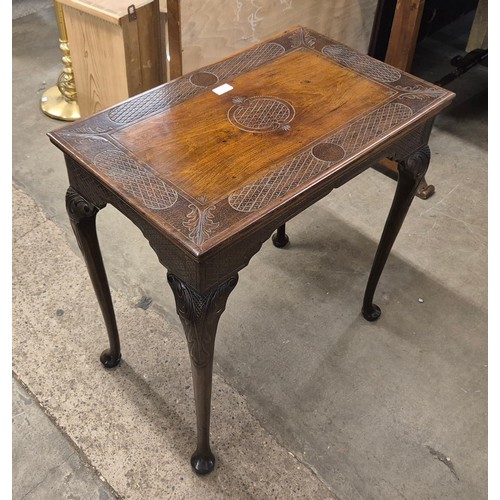 263 - A late Victorian carved walnut side table